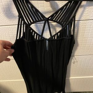 Buckle red straps black tank. Size Medium